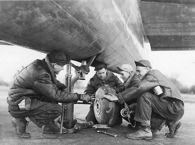 Mechanics_changing_tail_wheel_on_B-17_Bomber_385_Bomb_Group
