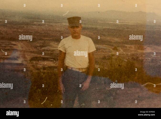 american-soldier-in-vietnam-standing-in-a-field-with-a-neutral-facial-KYF050