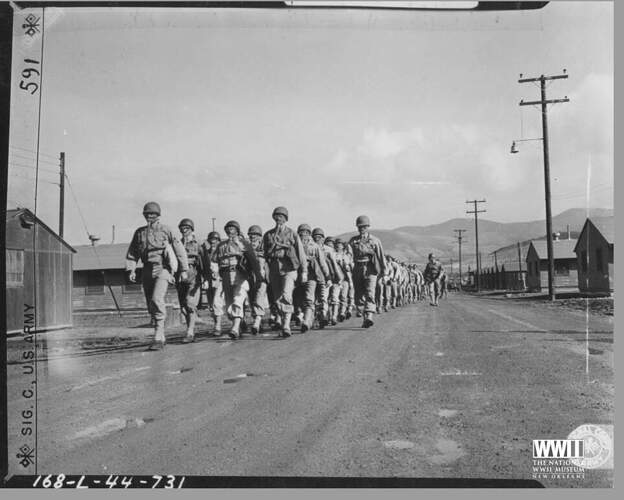 US Soldiers Marching While Wearing Gas Masks