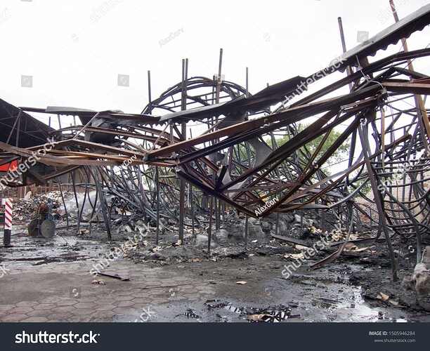 stock-photo-twisted-steel-beams-after-a-factory-fire-warehouse-destroyed-by-fire-twisted-metal-pile-of-burnt-1505946284