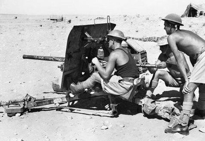 Rear left side view of the Ordnance QF 2-pdr anti-tank gun in Tobruk. North African with an Australian gunnery crew