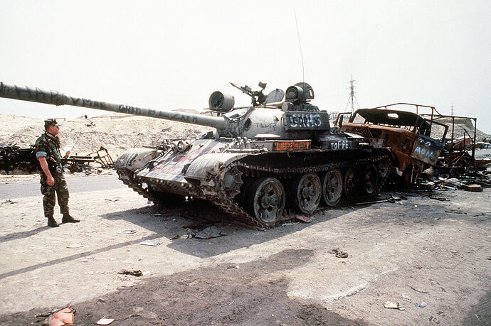 Destroyed_Iraqi_T-55_on_highway_between_Basra_&_Kuwait_City_1991-04-18_2.JPEG