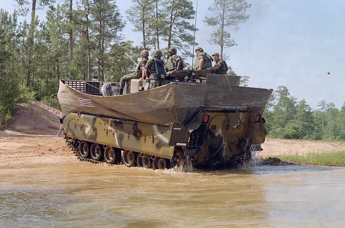 rear-view-of-an-m2-bradley-infantry-fighting-vehicle-exiting-the-water-at-victory-b4e87d-1600