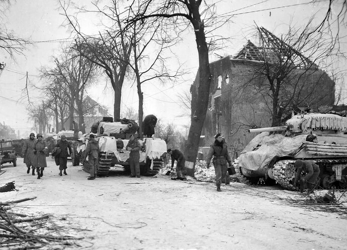 Churchill_and_M4_tanks_in_winter_camouflage_at_Lindern_Germany_1945