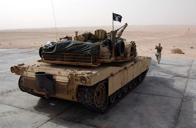 US_Navy_031214-N-3236B-008_A_Marine_from_the_13th_Marine_Expeditionary_Unit_(13th_MEU)_Tank_Platoon_BLT_1-1_stationed_at_Twentynine_Palms,_Calif.,_directs_an_M1-A1_Abrams_tank_during_a_training_exercise