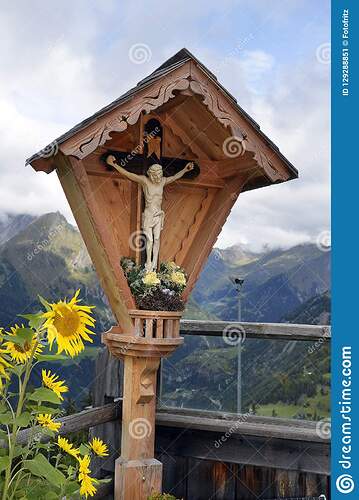 austria-tirol-christian-wayside-cross-sun-flowers-mountain-inn-east-tyrol-austria-tirol-wayside-cross-129288851