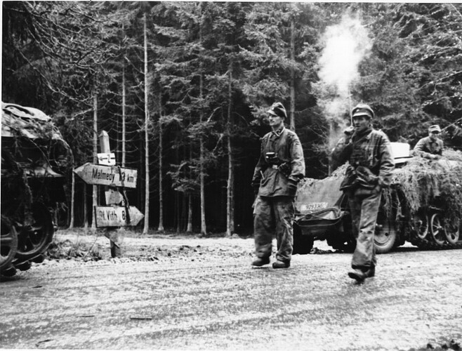 Oberscharfuhrer Persin (l) and Unterscharfuhrer Ochsner (r) walking