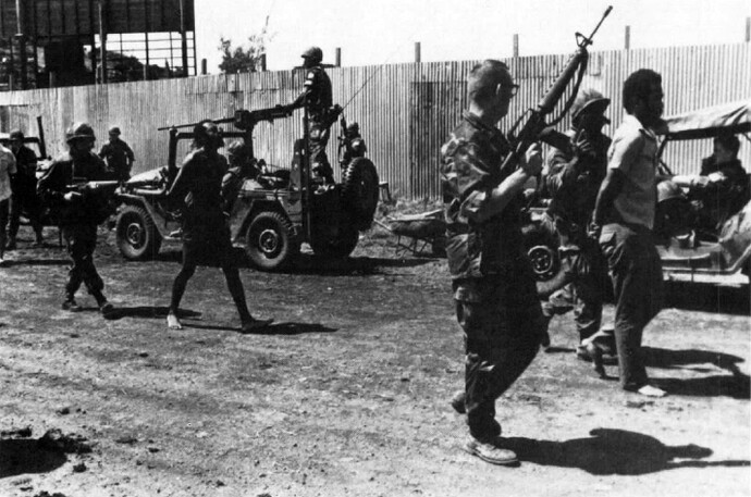 US_Marines_with_prisoners_Grenada_1983