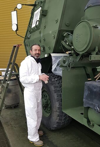 U.S. Army repainting its military vehicles with a woodland green paint scheme appropriate for the Europian region_2