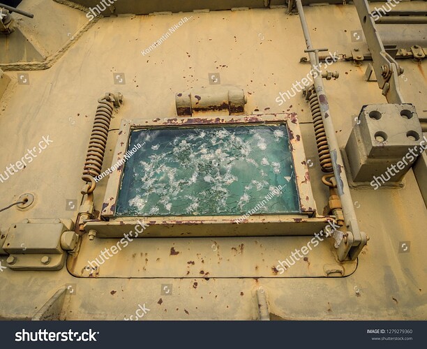 stock-photo-bulletproof-glass-of-tank-porthole-with-traces-rifts-and-marks-of-shots-window-on-armor-of-the-1279279360