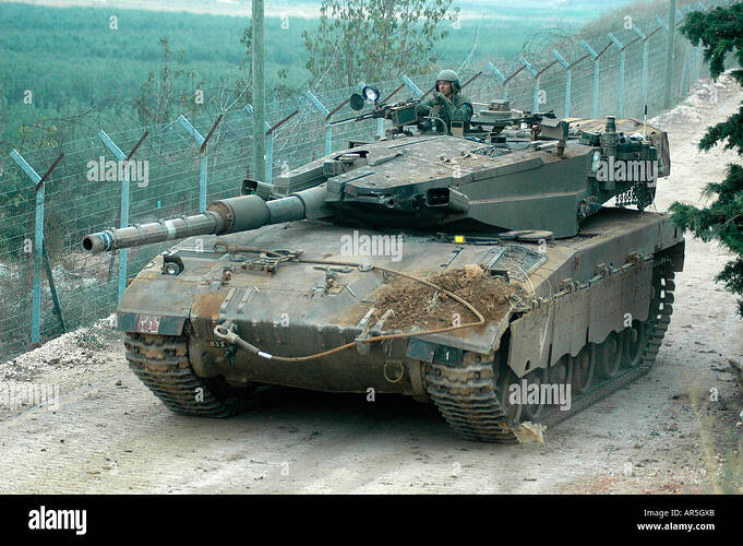 an-israeli-merkava-tank-rolls-along-the-border-with-lebanon-near-the-AR5GXB