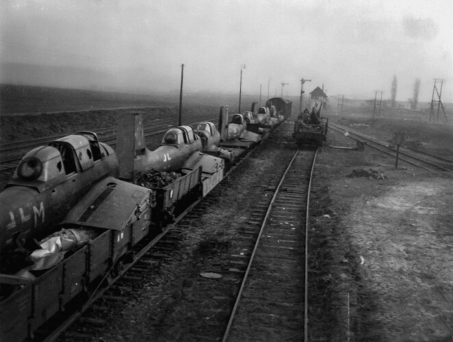 An abandoned train carrying Junkers Ju 87D aircraft near Hameln, Germany, in April 1945