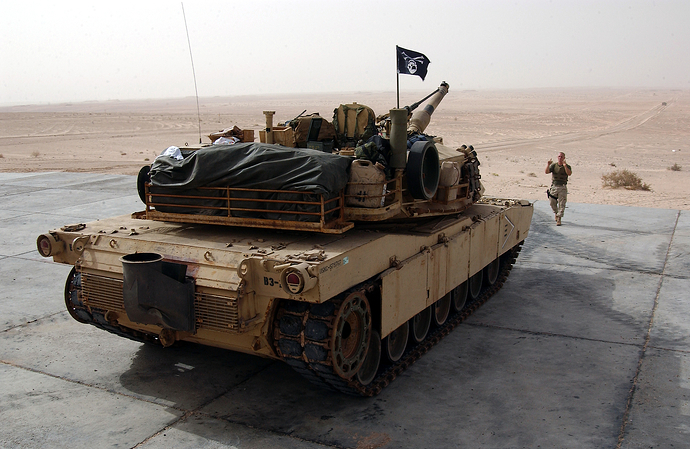 US_Navy_031214-N-3236B-008_A_Marine_from_the_13th_Marine_Expeditionary_Unit_(13th_MEU)_Tank_Platoon_BLT_1-1_stationed_at_Twentynine_Palms,_Calif.,_directs_an_M1-A1_Abrams_tank_during_a_training_exercise
