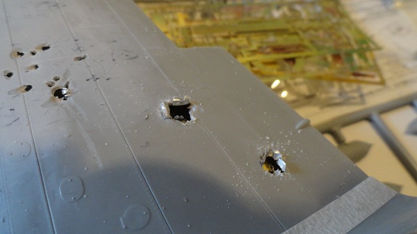 two new holes in the starboard wing