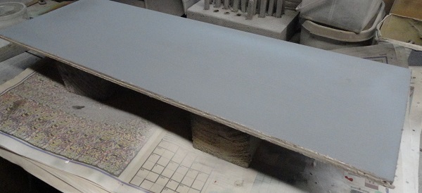 base board in grey primer